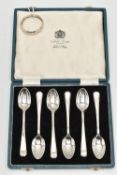 A CASED SET OF SIX SILVER TEASPOONS AND A NAPKIN RING, teaspoons hallmarked Sheffield 1965, together