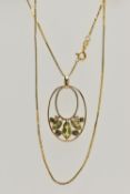 A YELLOW METAL GEM SET PENDANT AND A 9CT GOLD CHAIN, the oval open work pendant set with three