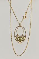 A YELLOW METAL GEM SET PENDANT AND A 9CT GOLD CHAIN, the oval open work pendant set with three