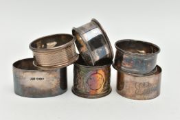 SIX NAPKIN RINGS, four silver circular rings, one oval ring, various patterns, all with full