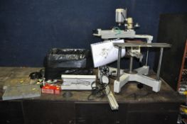 A GRAVOGRAPH IM3 MANUAL ENGRAVING MACHINE with attachments and a box of letters, stamps, and cutters