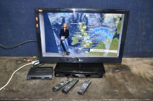 A LG 32LE3300 32in TV with remote, a Bush Freeview box with remote both PAT -pass and working) and a