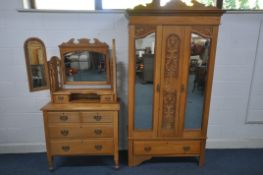 AN EARLY 20TH CENTURY SATINWOOD BEDROOM SUITE, comprising a wardrobe, with two mirrored doors,