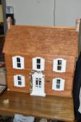 A MODERN KIT BUILT WOODEN DOLLS HOUSE, modelled as a Victorian villa, removable front and front half