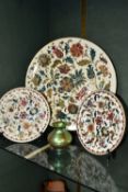 FOUR PIECES OF ZSOLNAY CERAMICS, comprising a florally decorated charger, diameter 38cm, impressed