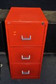 A MODERN METAL THREE DRAWER FILING CABINET red in colour with one key width 47cm depth 62cm height