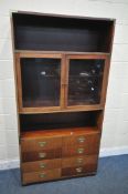 A MODERN MAHOGANY CAMPAIGN BOOKCASE, with two glazed doors and eight drawers, width 101cm x depth