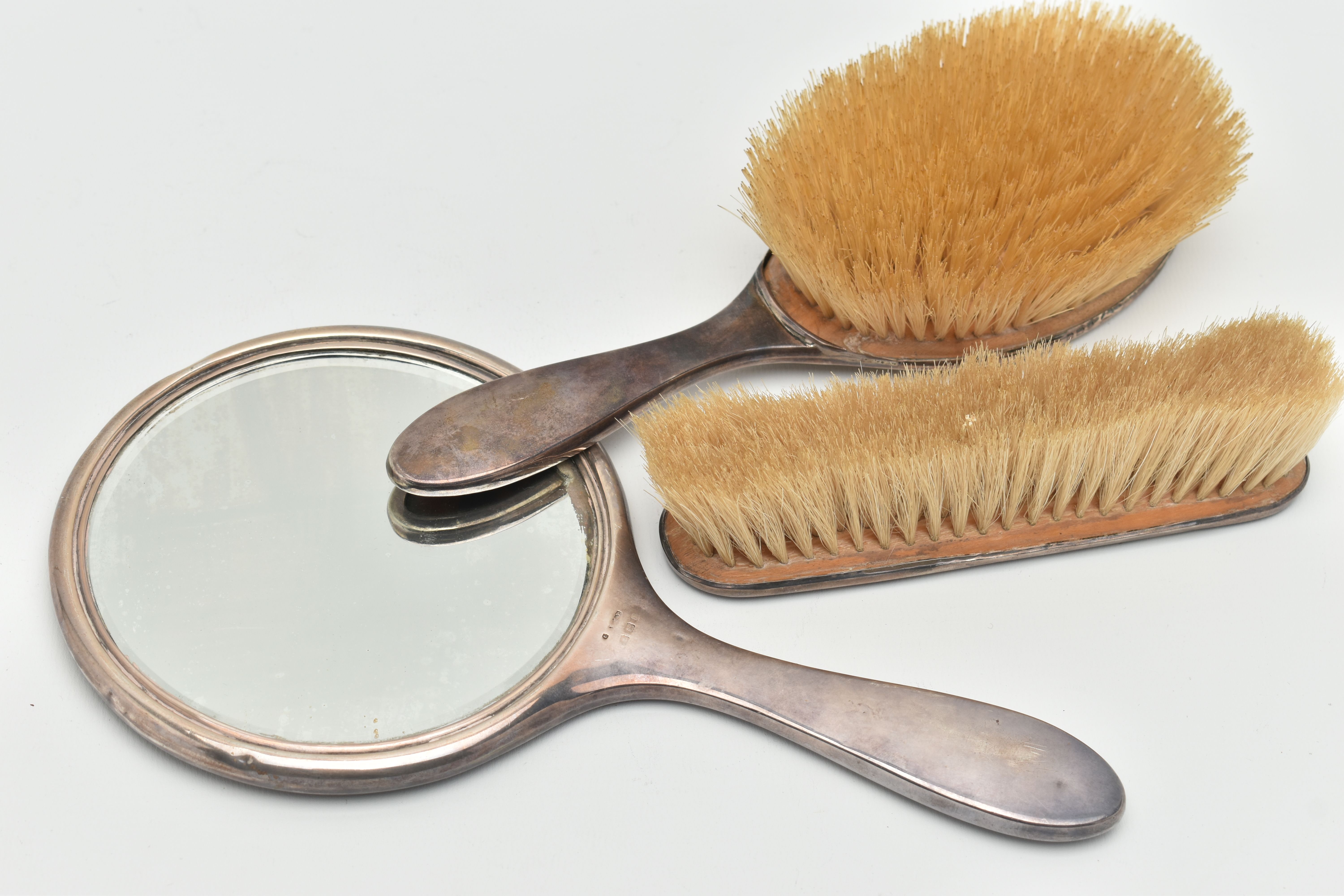 A SILVER AND TORTOISESHELL THREE PIECE VANITY SET, comprising of a hair brush, clothes brush and a - Image 2 of 3