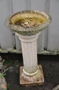 A MODERN COMPOSITE BIRD BATH on a Corinthian column 78cm high Condition Report: no apparent cracks