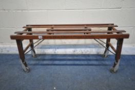 AN EARLY 20TH CENTURY WOODEN FOLDING BT TUB BENCH LUGGAGE RACK, by Beatty Bros Limited. Fergus.