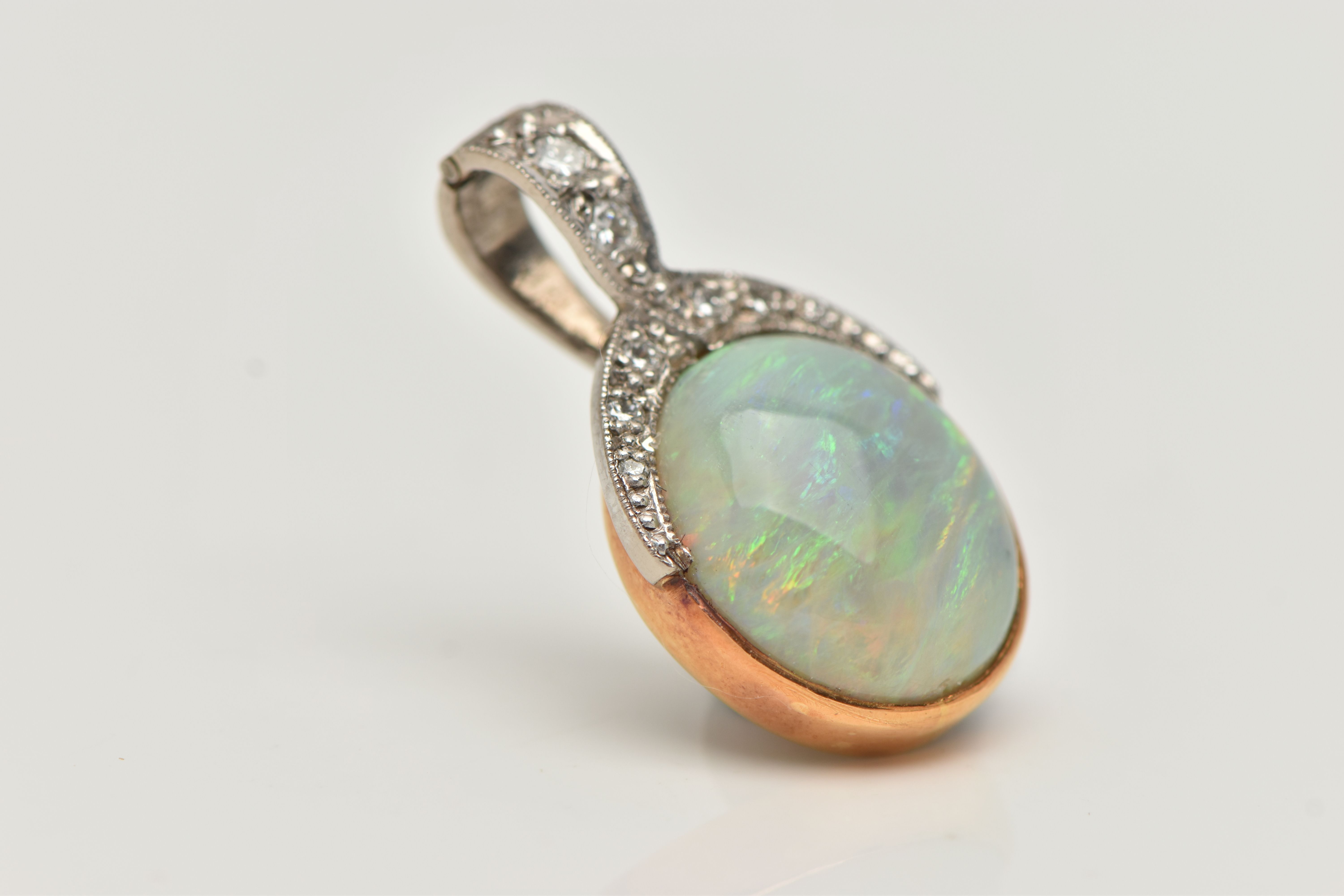 AN OPAL AND DIAMOND PENDANT, a large oval cabochon opal, collet set in yellow metal, leading on to a - Image 2 of 4