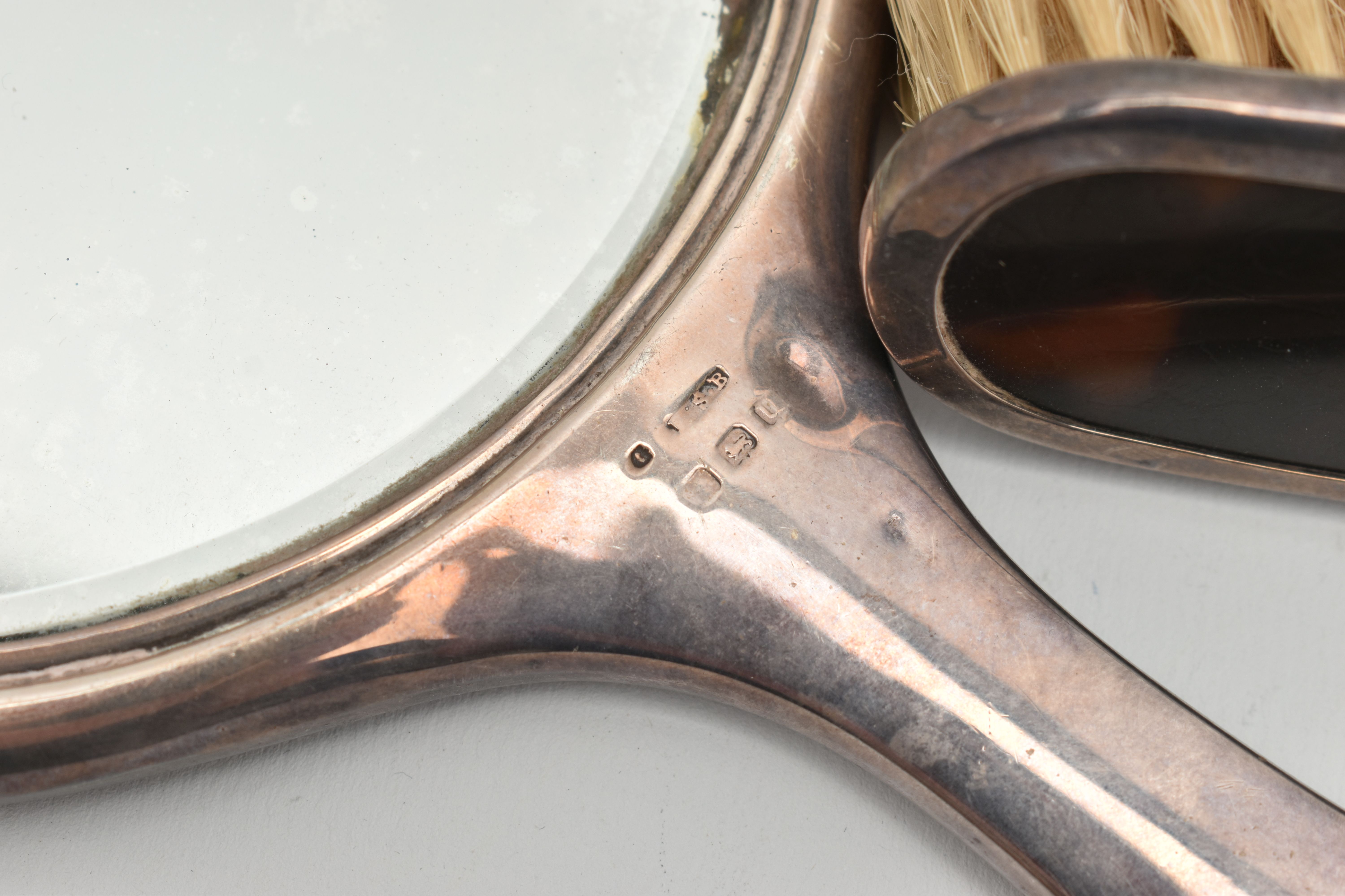 A SILVER AND TORTOISESHELL THREE PIECE VANITY SET, comprising of a hair brush, clothes brush and a - Image 3 of 3