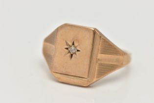 A GENTS 9CT GOLD DIAMOND SET SIGNET RING, rectangular signet set with a central star set single