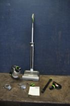 A G TECH AIR RAM UPRIGHT VACUUM CLEANER and a G Tech hand held cordless vacuum both with power
