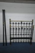 A 19TH CENTURY CAST IRON AND BRASS 4FT BEDSTEAD, with irons (condition report: one castor missing,