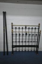 A 19TH CENTURY CAST IRON AND BRASS 4FT BEDSTEAD, with irons (condition report: one castor missing,