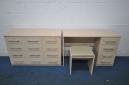 A MODERN BEECH EFFECT THREE PIECE BEDROOM SUITE, comprising a chest of eight drawers, length 113cm x