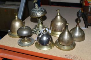 SEVEN BRASS BELLS, mainly desk bells and one hand bell, assorted styles (7) (Condition Report: