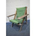 A NORFOLK LEISURE GEORGIANA TEAK FRAMED AND GREEN UPHOLSTERED SWINGING GARDEN CHAIR, with front rope