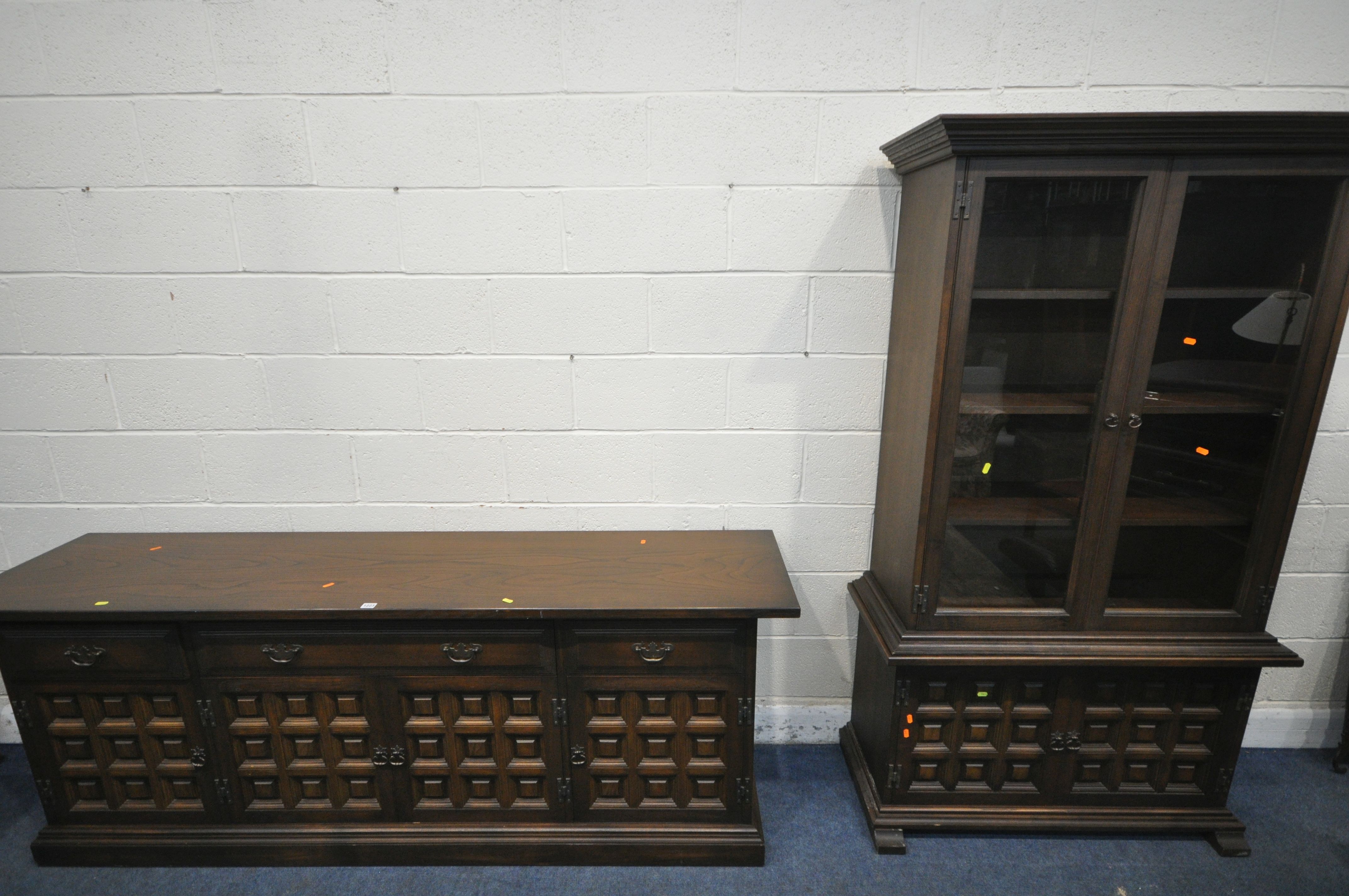 A YOUNGER TOLEDO OAK SIDEBOARD, with three drawers above four cupboard doors, length 207cm x depth