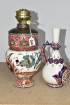 A ZSOLNAY PORCELAIN OIL LAMP BASE AND RETICULATED ZSOLNAY VASE, the oil lamp is painted with an