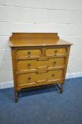 A 20TH CENTURY OAK CHEST OF TWO SHORT OVER TWO LONG DRAWERS, with a raised back, drawers with