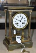 A BRASS FOUR GLASS MANTEL CLOCK, with mercury pendulum, enamel dial with Roman numerals and Arabic
