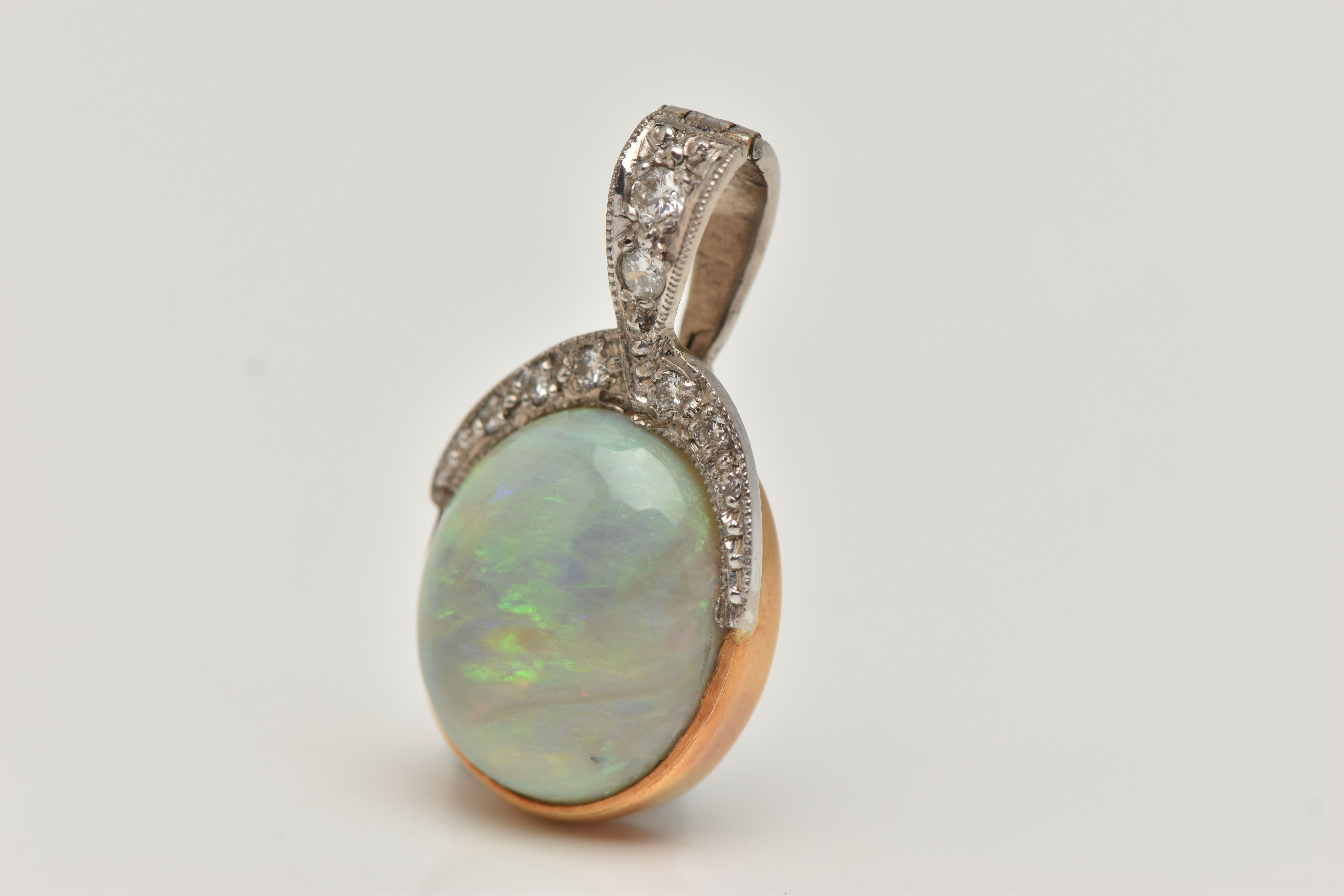 AN OPAL AND DIAMOND PENDANT, a large oval cabochon opal, collet set in yellow metal, leading on to a - Image 3 of 4