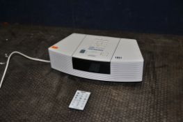 A BOSE WAVE CD RADIO with remote (PAT pass, powers up, radio working but not working)