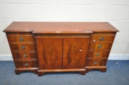 A MODERN MAHOGANY BREAKFRONT SIDEBOARD, fitted with two drawers, four cupboard doors and a