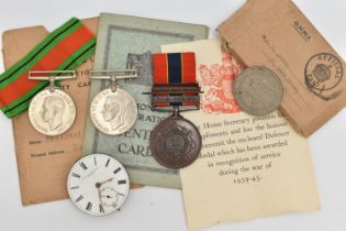 AN ASSORTMENT OF WWII MEDALS AND NATIONAL REGISTRATION IDENTITY CARDS, three service medals, a