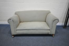 A 19TH CENTURY TWO SEATER SOFA, with blue and beige upholstery, on front bun feet and castors,