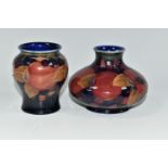 TWO MOORCROFT POTTERY 'POMEGRANATE' PATTERN VASES, each tube-lined with pomegranates, leaves and