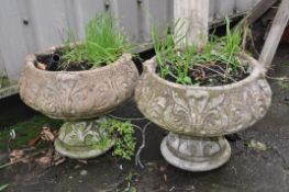 A PAIR OF MODERN COMPOSITE GARDEN PLANTERS with foliage detail to bowl and base both constructed