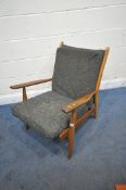 A MID CENTURY DANISH TEAK ARMCHAIR, with open armrests, on cylindrical tapered legs, upholstered