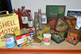 A COLLECTION OF VINTAGE TINS AND ADVERTISING BOTTLES, comprising four engine oil bottles, two