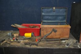A TIN TRUNK AND A BOX CONTAINING VINTAGE TOOLS including a slaters ripper, Blakey's and Segs shoe