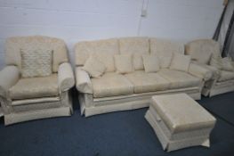A GOLD AND FLORAL UPHOLSTERED FOUR PIECE LOUNGE SUITE, comprising a three seater sofa, length
