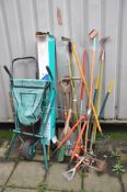 A COLLECTION OF GARDEN TOOLS including a sack truck (distressed), a parasol (unchecked), forks,