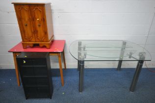 A GLASS TOP DINING TABLE, with extending rounded sides underneath, length 149cm x depth 90cm x