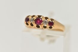 AN EARLY 20TH CENTURY DIAMOND AND RUBY RING, three circular cut rubies, prong set with two old cut