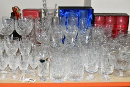 A QUANTITY OF CUT CRYSTAL, comprising a set of four large wine glasses, champagne flutes, a boxed