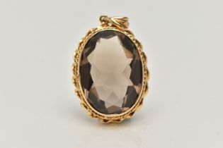 A 9CT GOLD SMOKEY QUARTZ PENDANT, set with an oval shaped mixed cut smoky quartz, within a rope