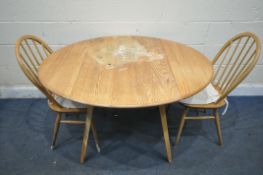 A DISTRESSED ERCOL ELM AND BEECH WINDSOR DROP LEAF DINING TABLE, open length 125cm x closed length