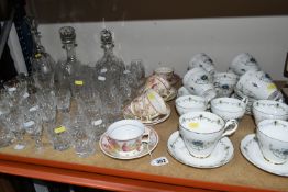 A GROUP OF CUT GLASSWARE AND CERAMICS, a collection of twelve miniature houses and cottages, to