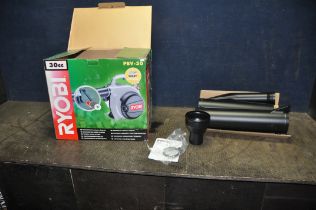 A RYOBI PBV-30 PETROL GARDEN BLOWER/VAC in box and appears unused