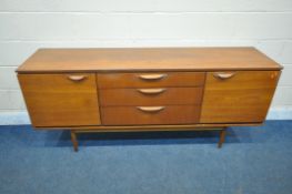 A MID CENTURY AUSTINSUITE TEAK SIDEBOARD, with three graduated drawers, flanked by a cupboard door