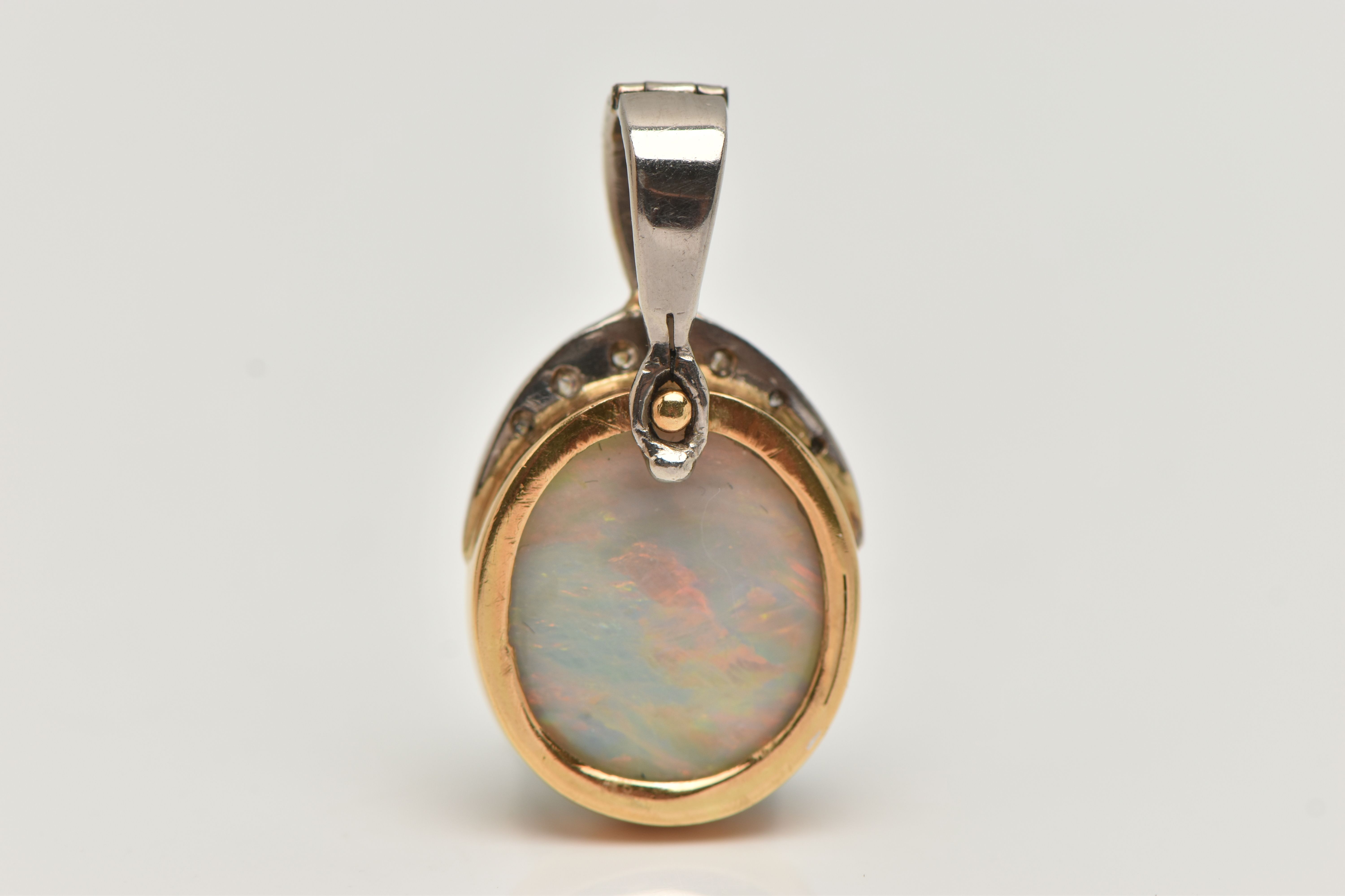 AN OPAL AND DIAMOND PENDANT, a large oval cabochon opal, collet set in yellow metal, leading on to a - Image 4 of 4