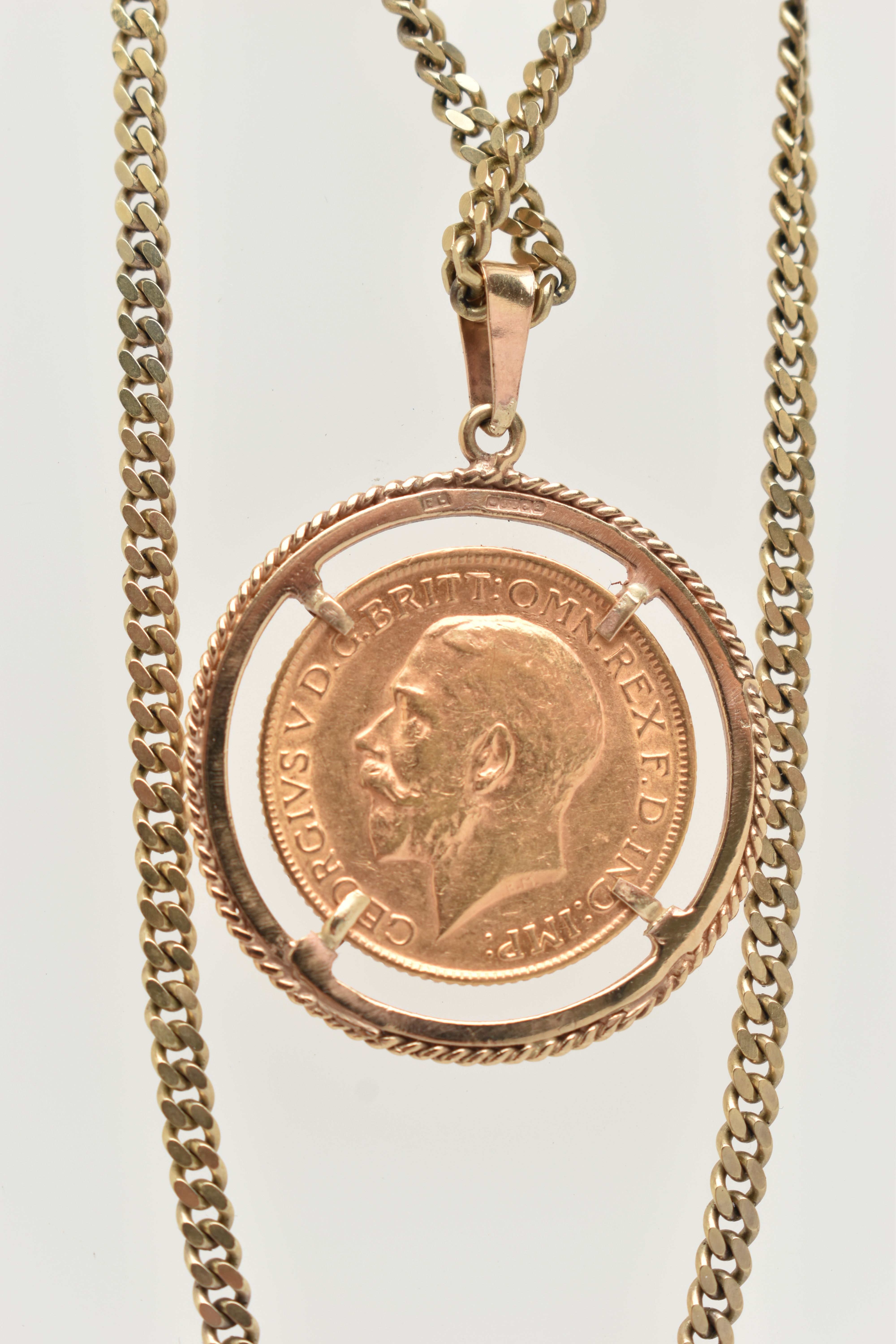 A SOVEREIGN PENDANT AND CHAIN, designed as a George V 1914 full sovereign within a circular 9ct - Image 4 of 4