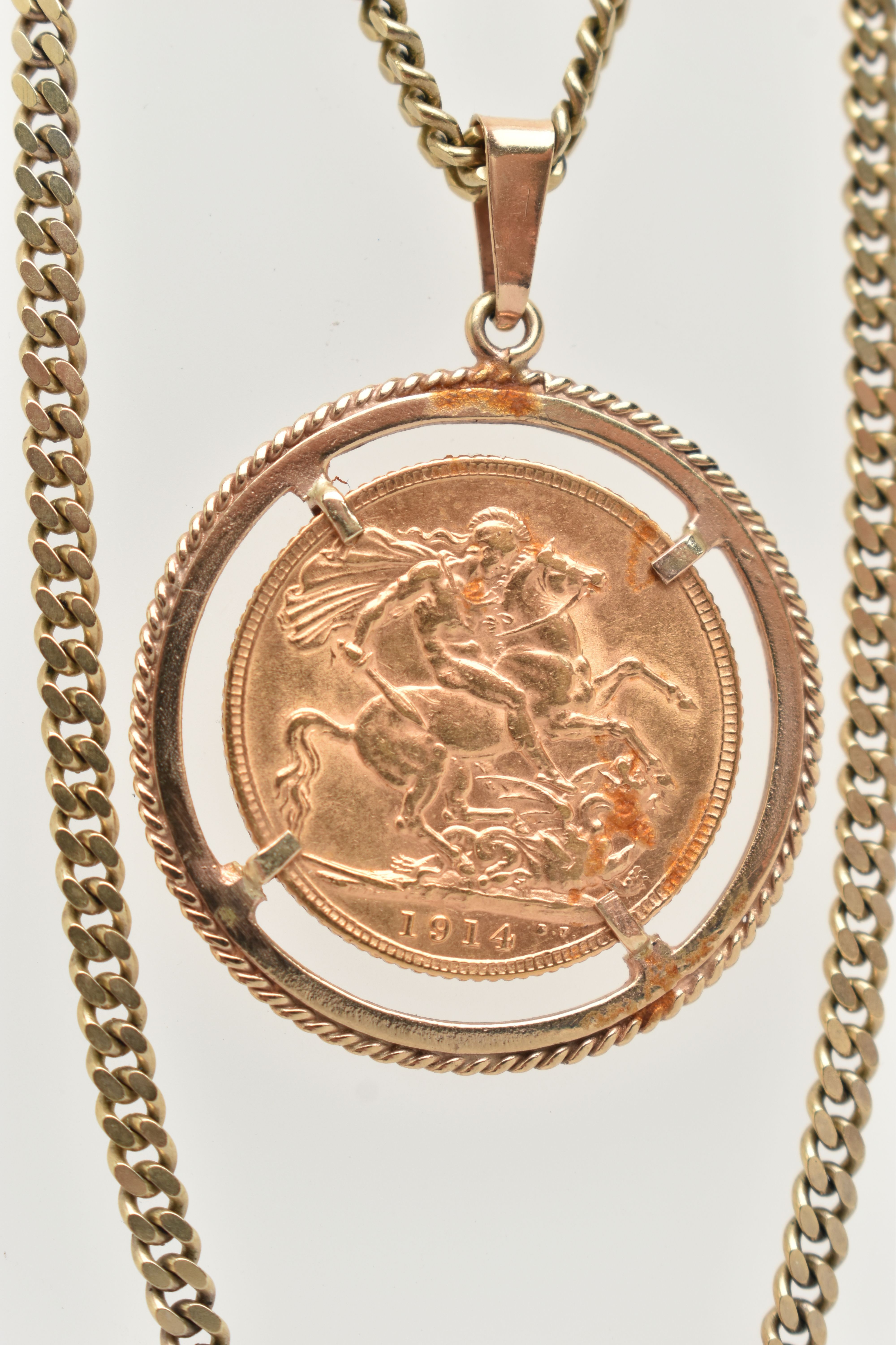 A SOVEREIGN PENDANT AND CHAIN, designed as a George V 1914 full sovereign within a circular 9ct - Image 2 of 4
